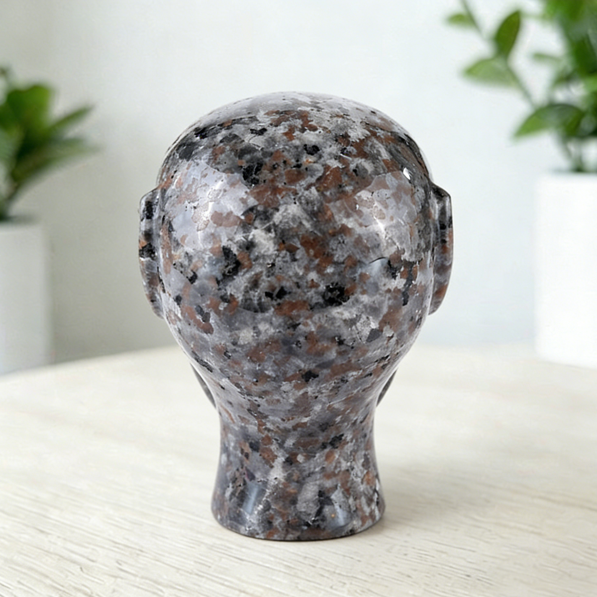 Additional view of a 3-inch Fire Stone alien skull carving