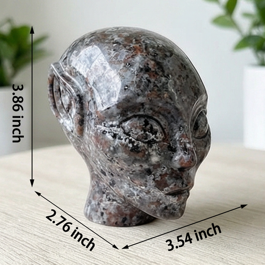 Additional view of a 3.8-inch Fire Stone alien skull carving