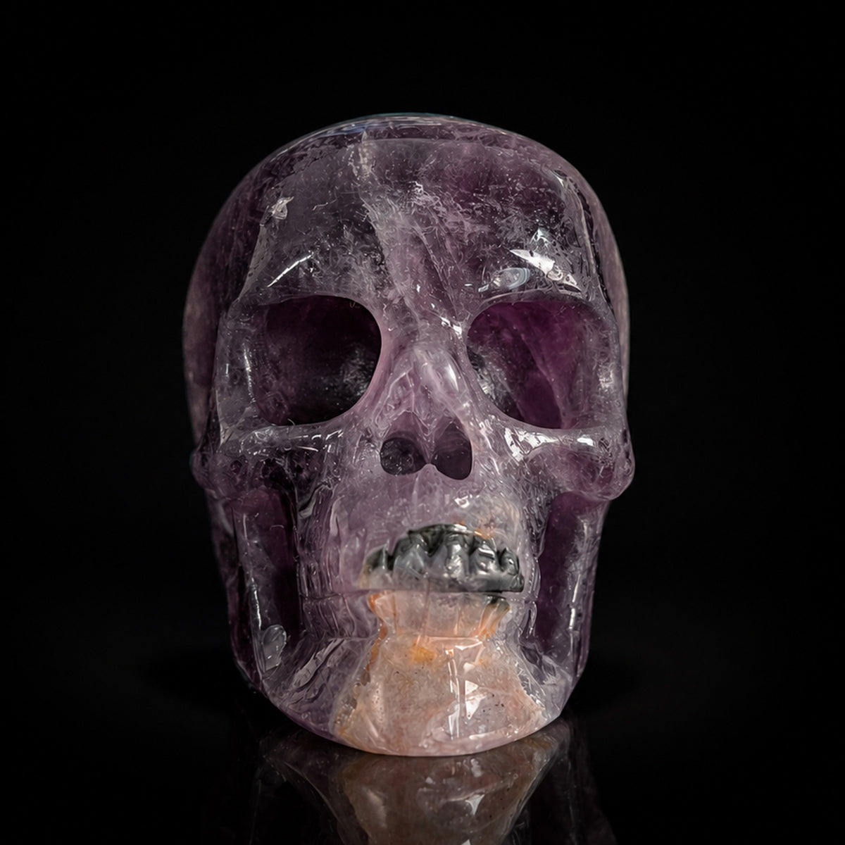 Front view of a 2-inch Fluorite human skull carving