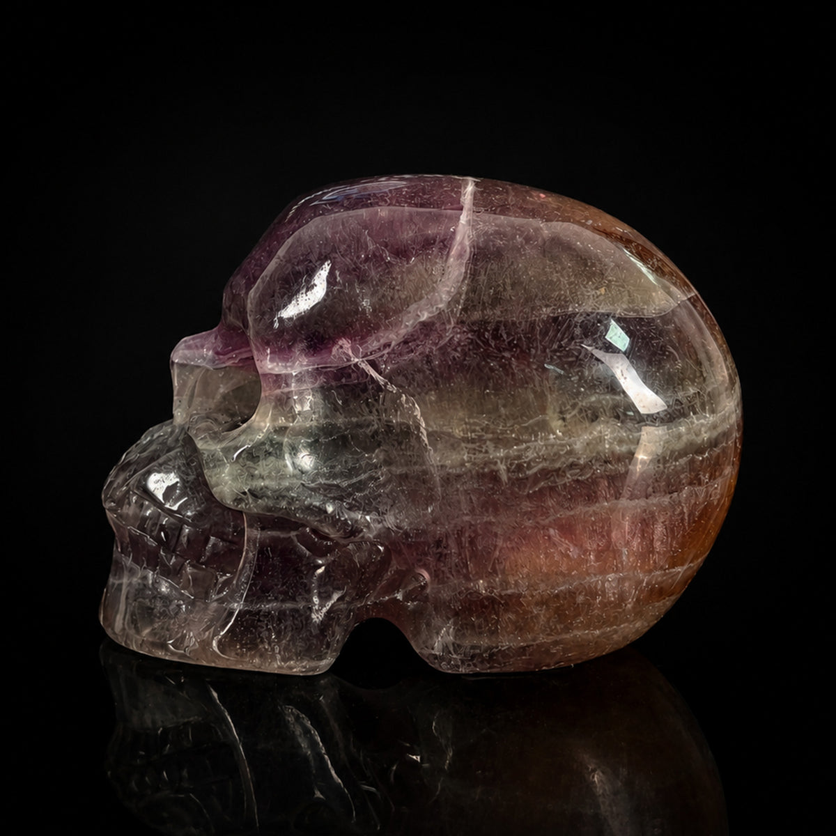 Left view of a 2-inch Fluorite human skull carving