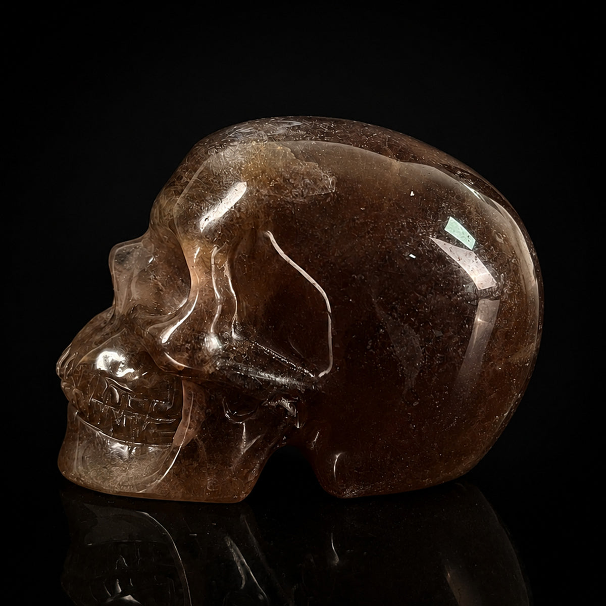 Left view of a 2-inch Fluorite human skull carving