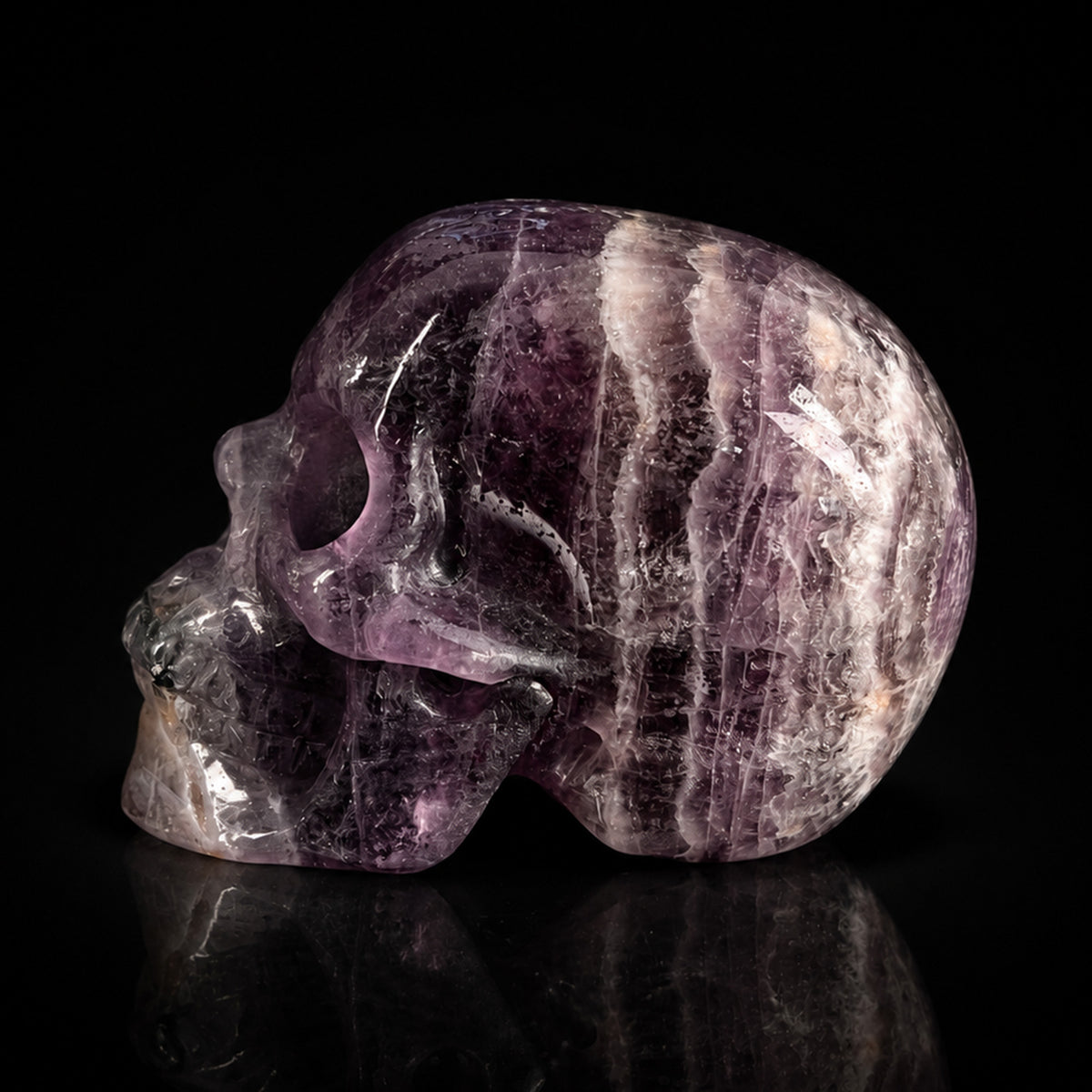 Left view of a 2-inch Fluorite human skull carving