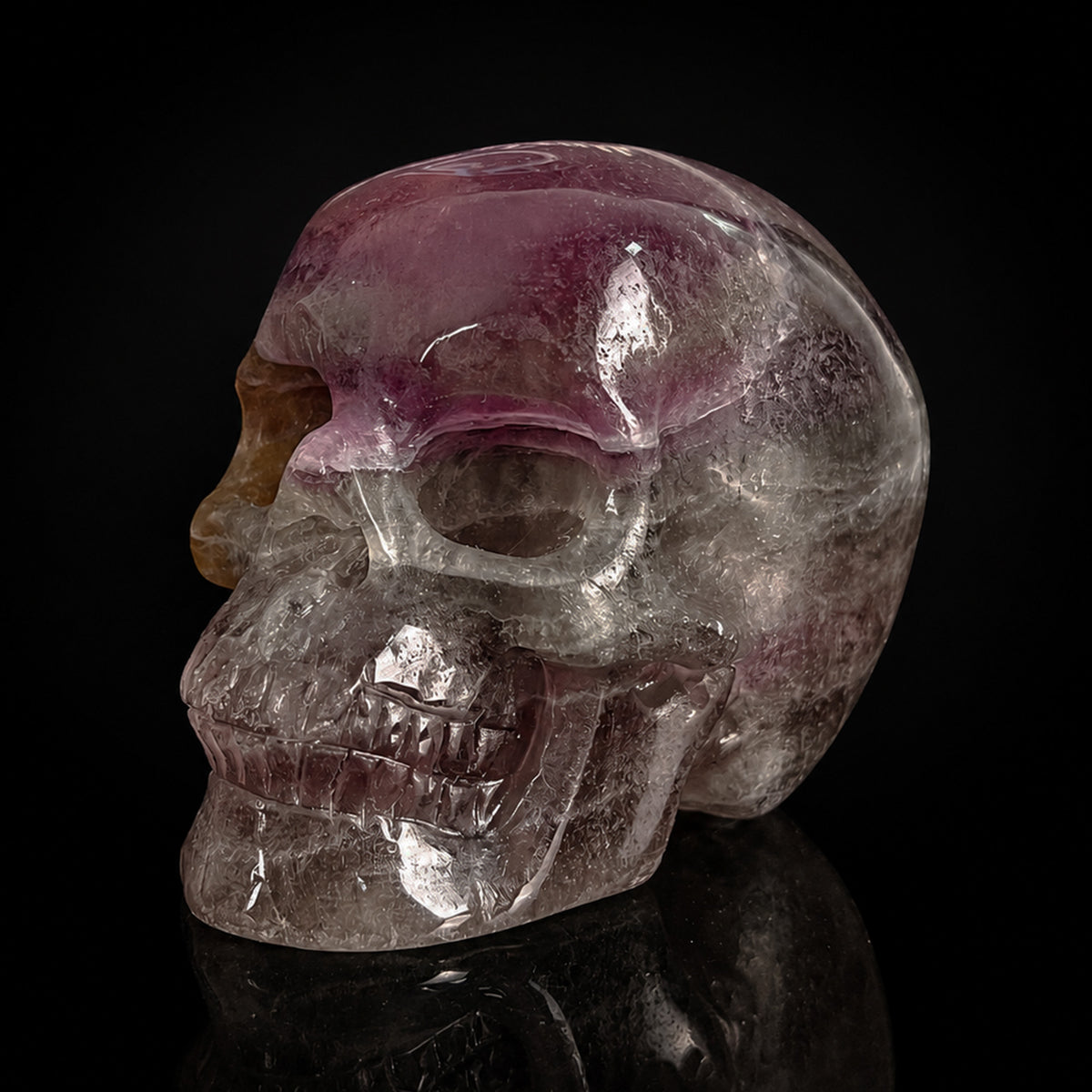 Left-front view of a 2-inch Fluorite human skull carving