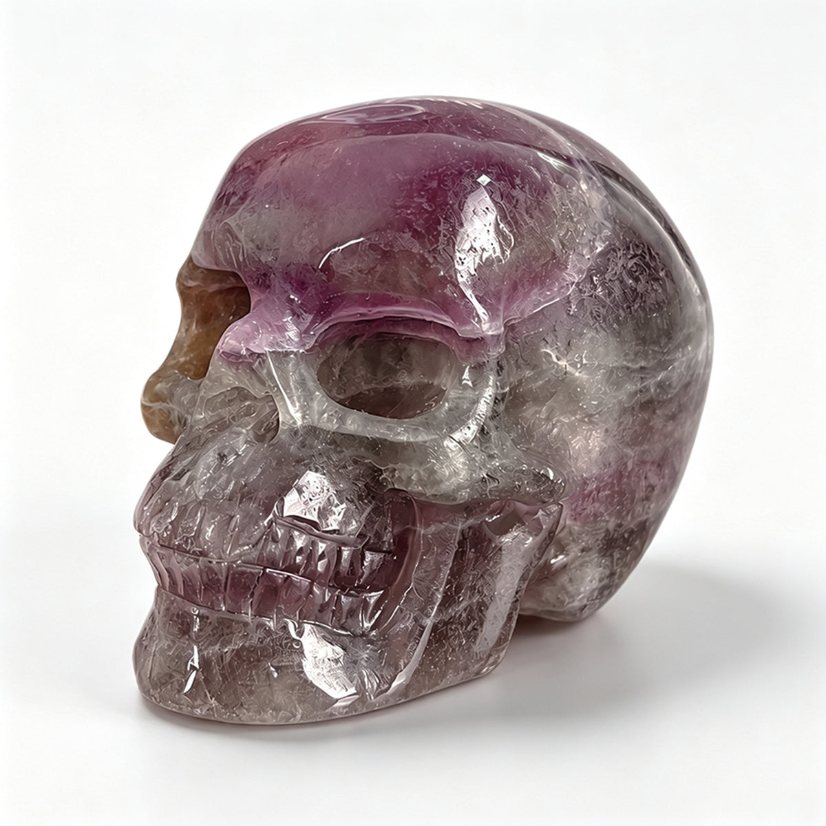 Left-front view of a 2-inch Fluorite human skull carving