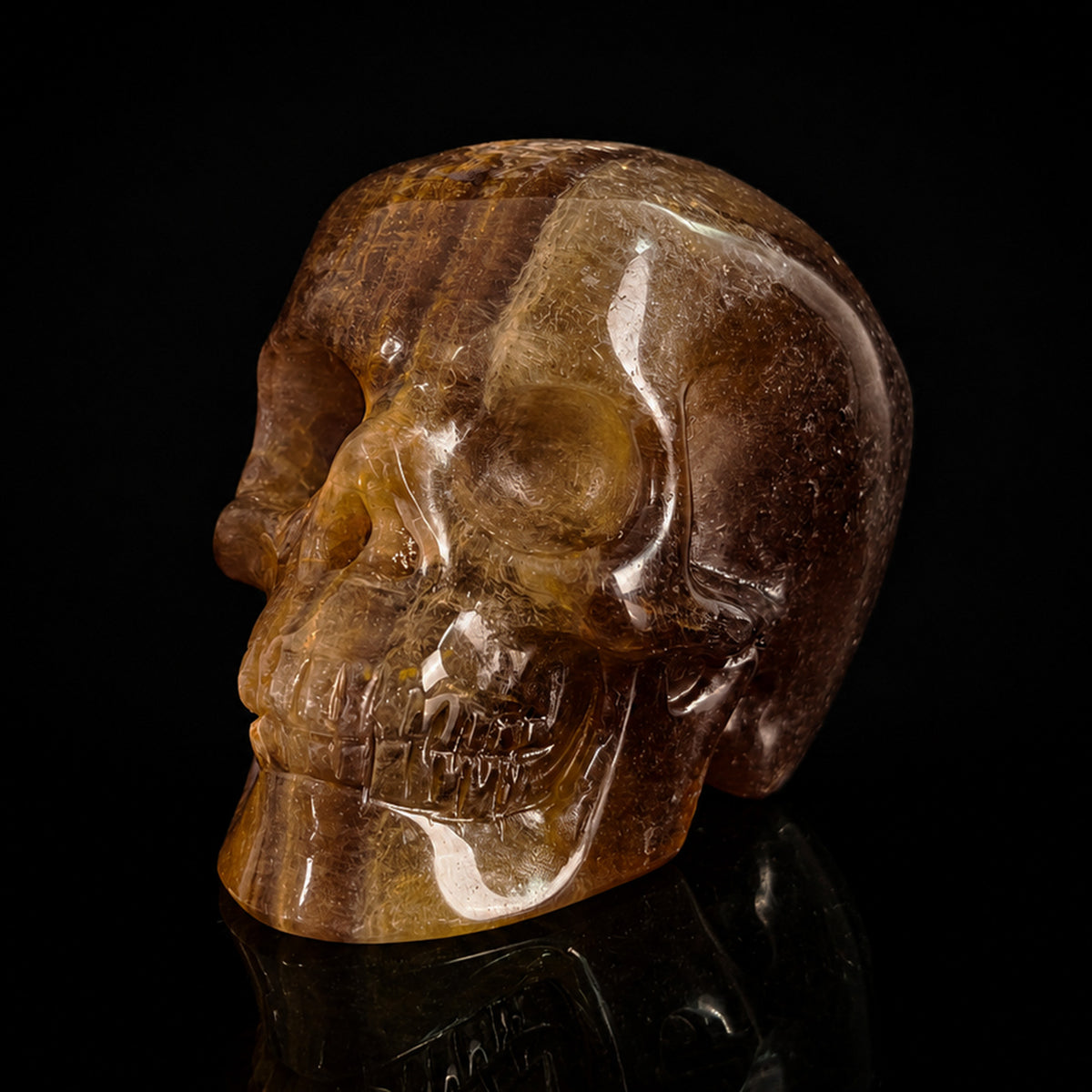 Left-front view of a 2-inch Fluorite human skull carving