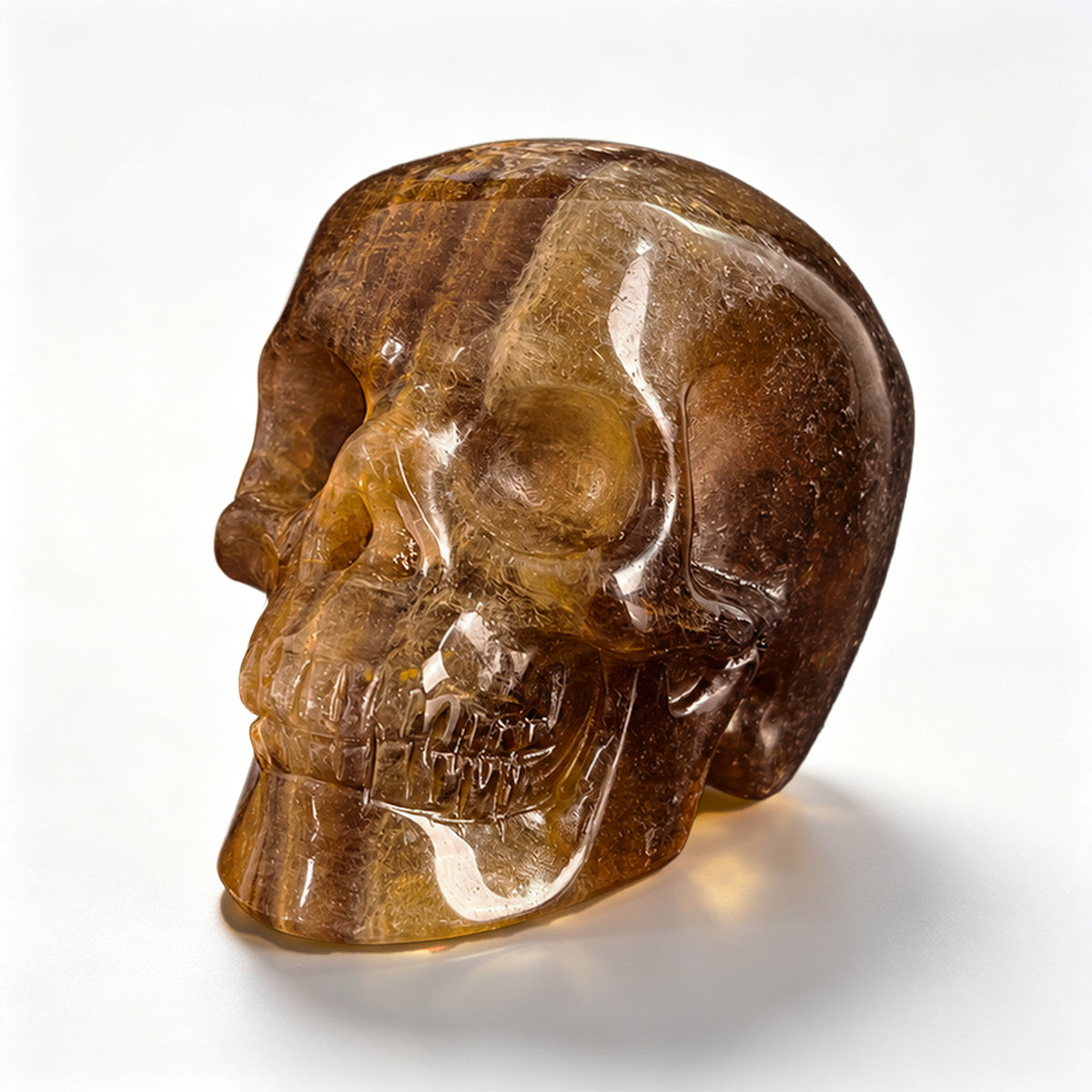 Left-front view of a 2-inch Fluorite human skull carving