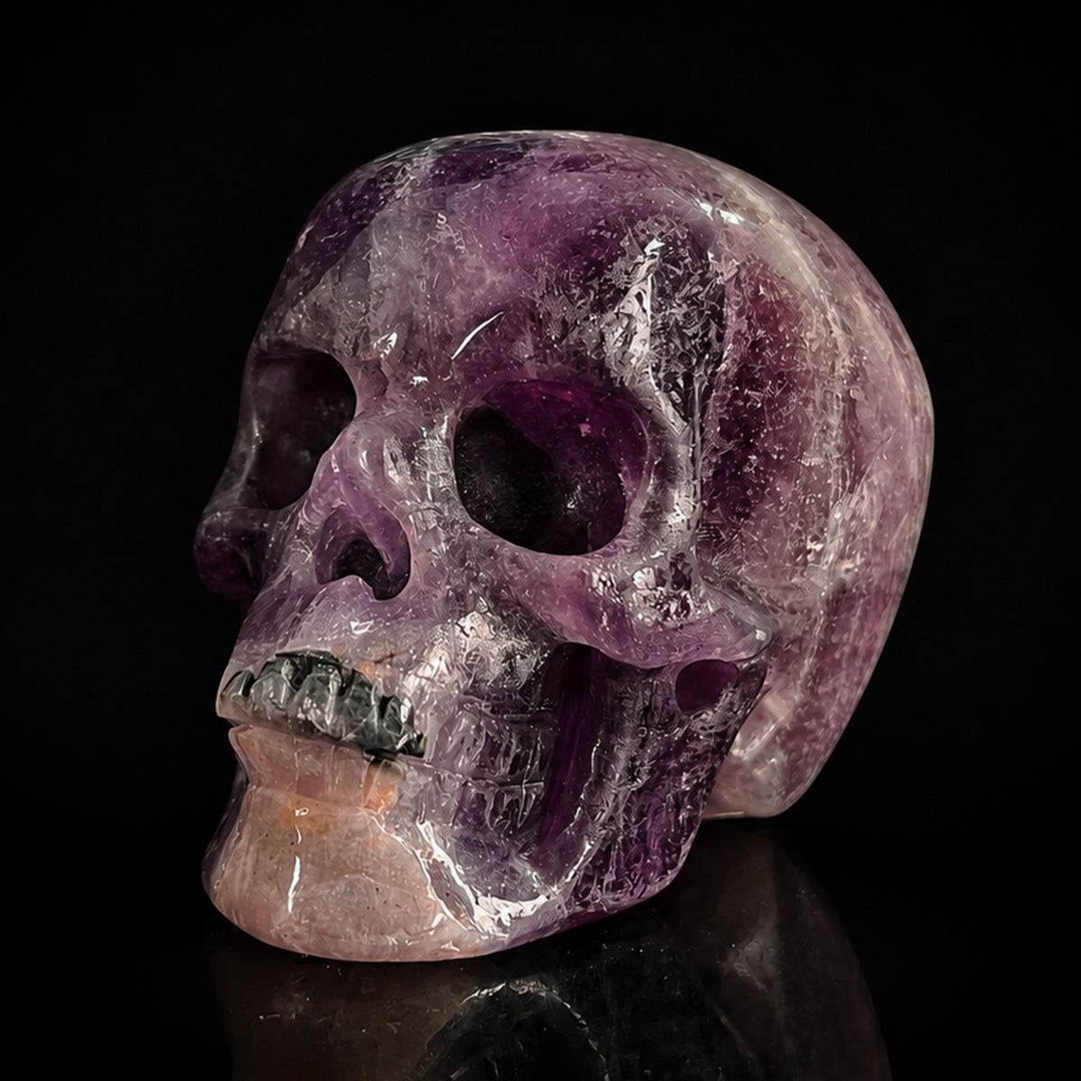 Left-front view of a 2-inch Fluorite human skull carving