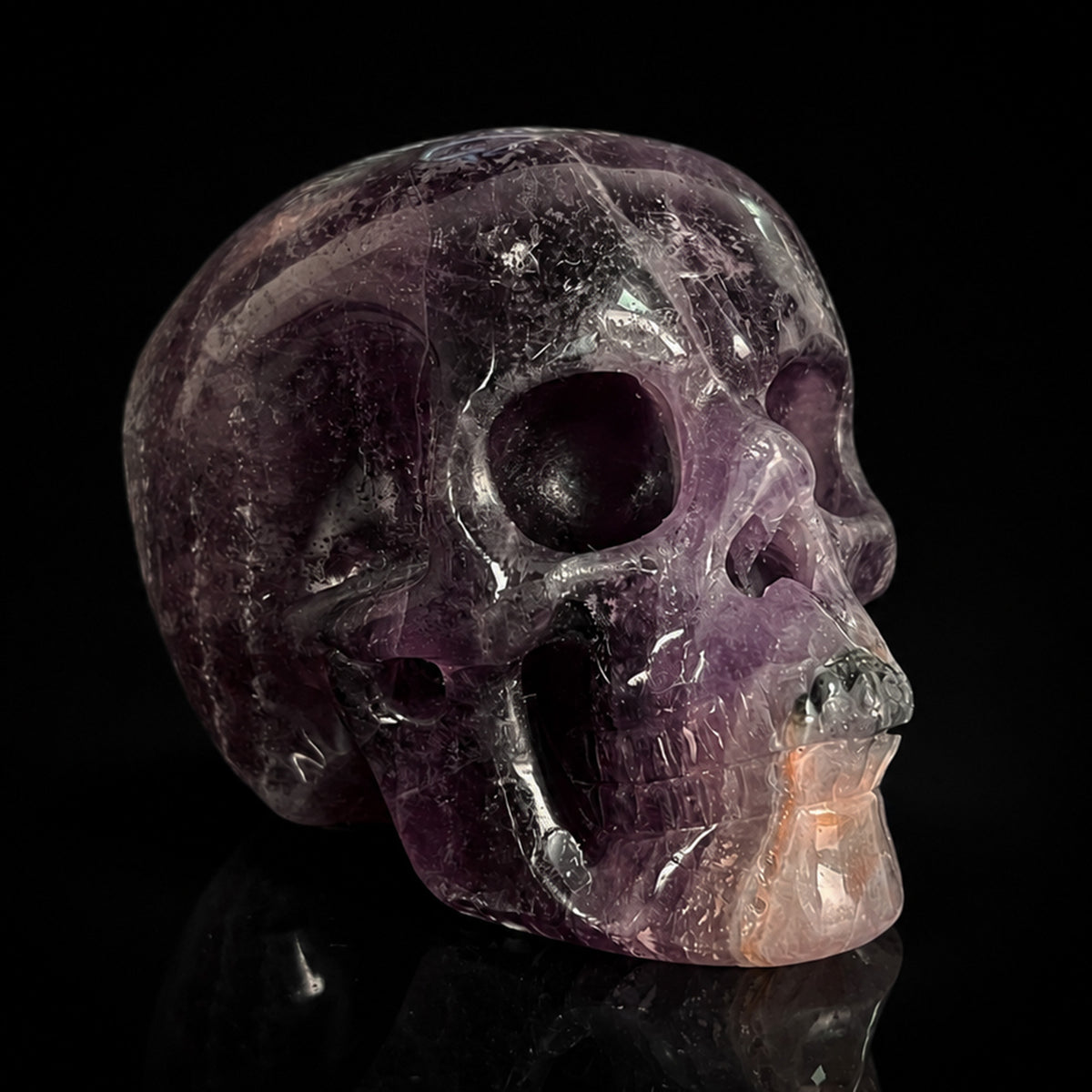 Right-front view of a 2-inch Fluorite human skull carving