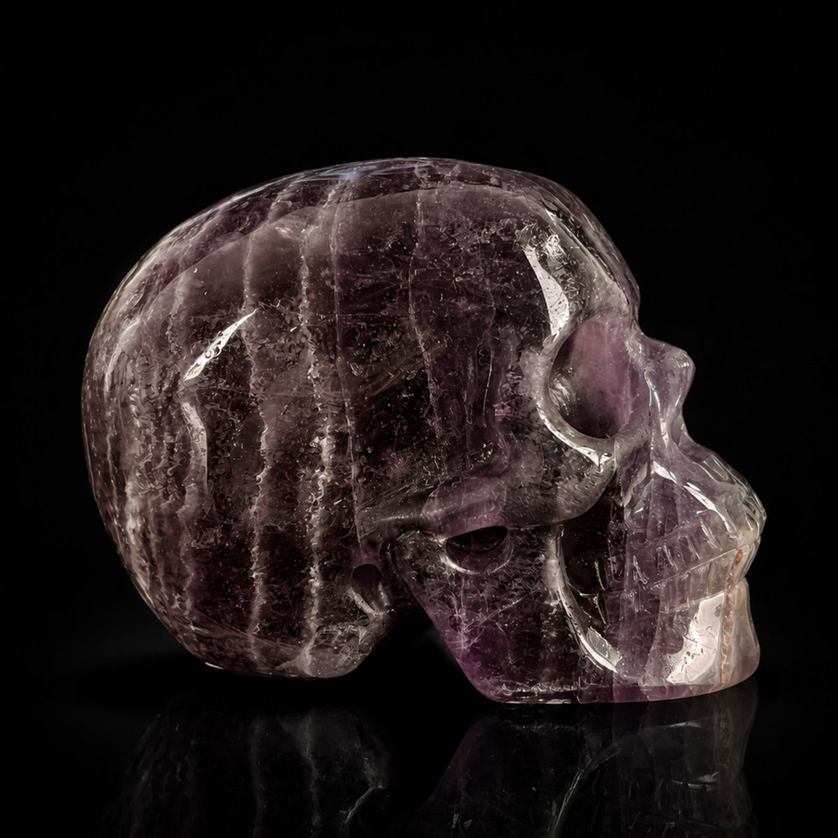 Right-side view of a 2-inch Fluorite human skull carving