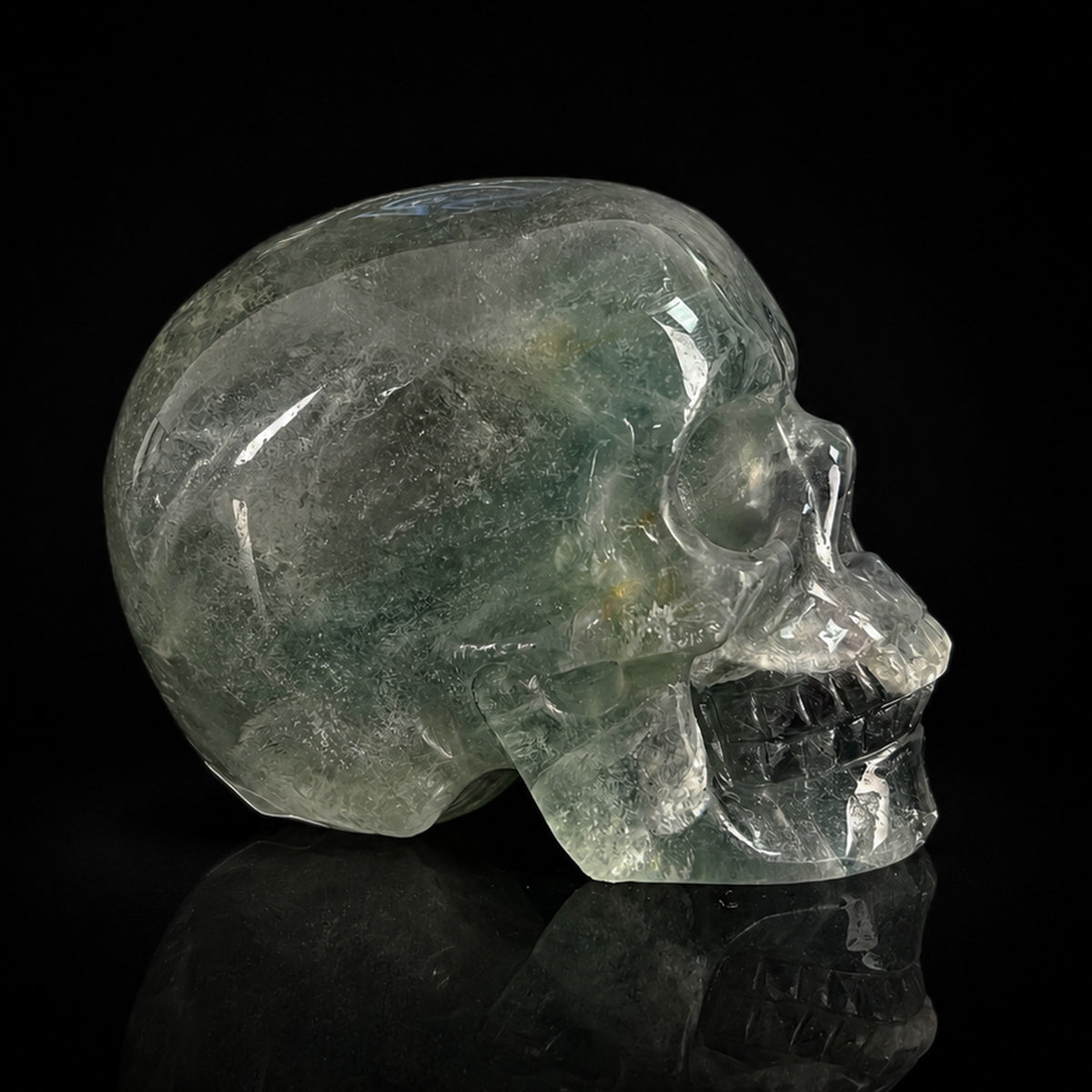 Right-side view of a 2-inch Fluorite human skull carving