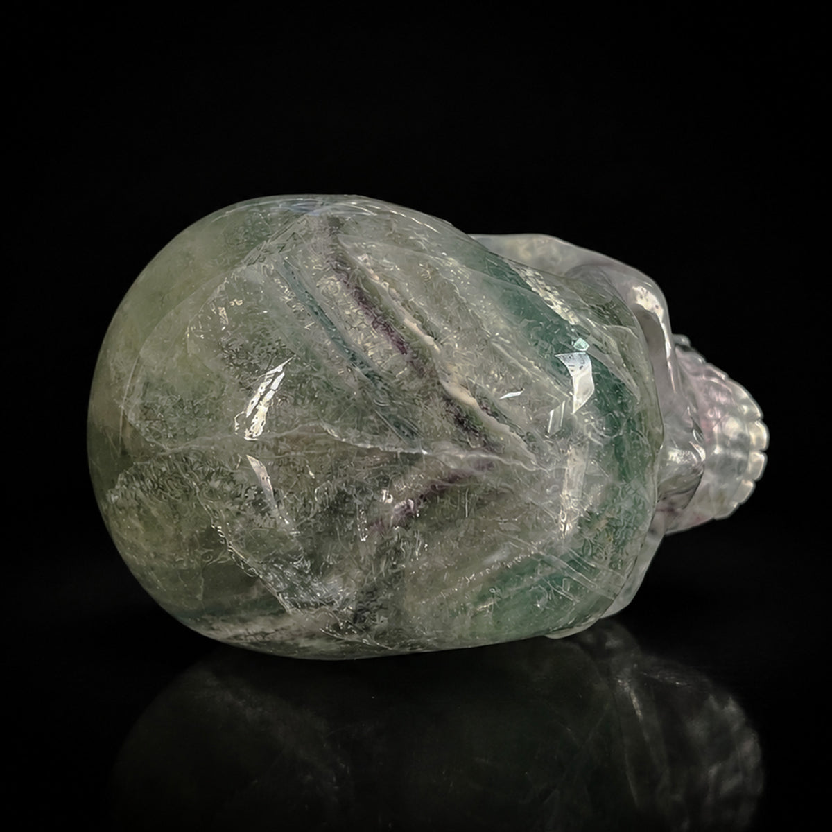 Top view of a 2-inch Fluorite human skull carving