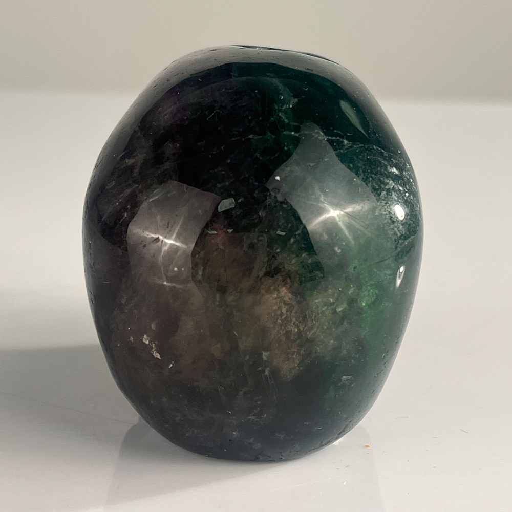 Back view of a 3-inch Fluorite human skull carving