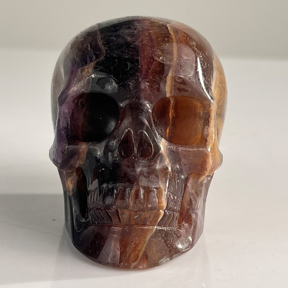 Front view of a 3-inch Fluorite human skull carving