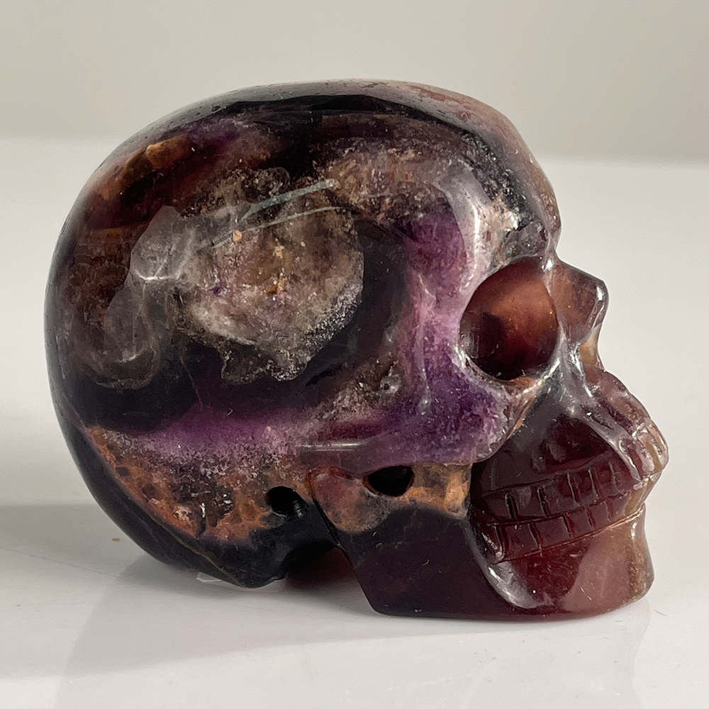 Right-side view of a 3-inch Fluorite human skull carving