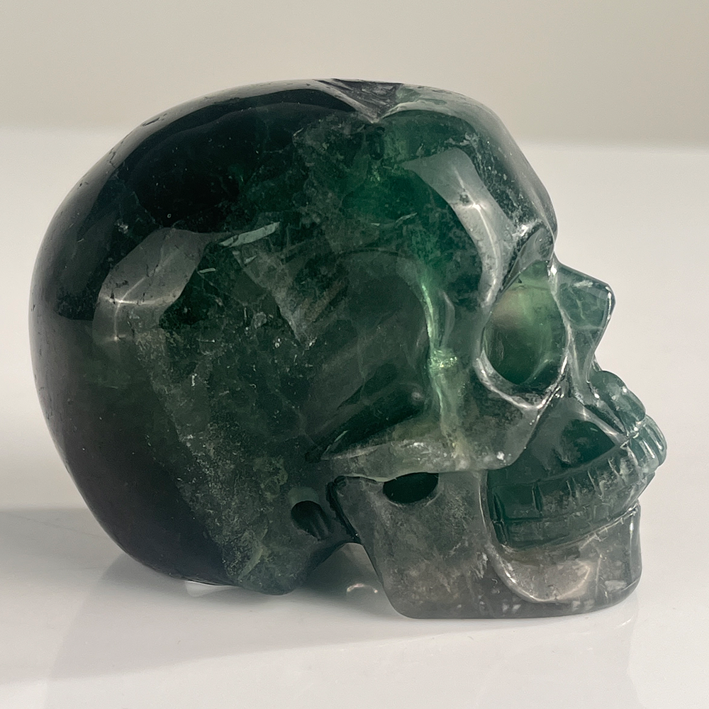Right view of a 3-inch Fluorite human skull carving