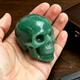 Additional view of a 2-inch Green Aventurine human skull carving