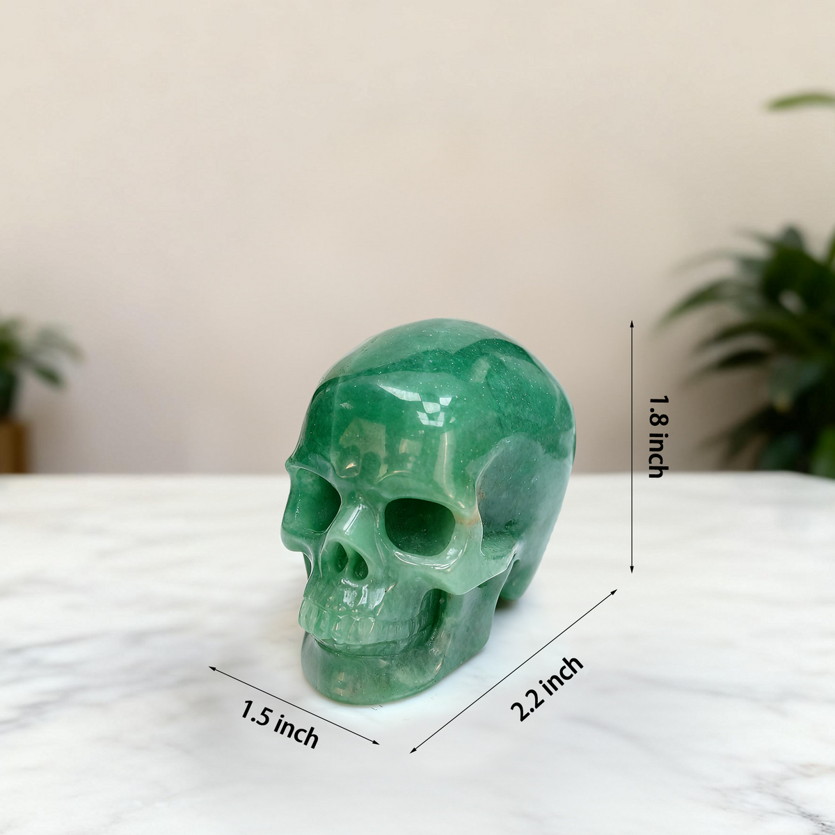 Additional view of a 2-inch Green Aventurine human skull carving