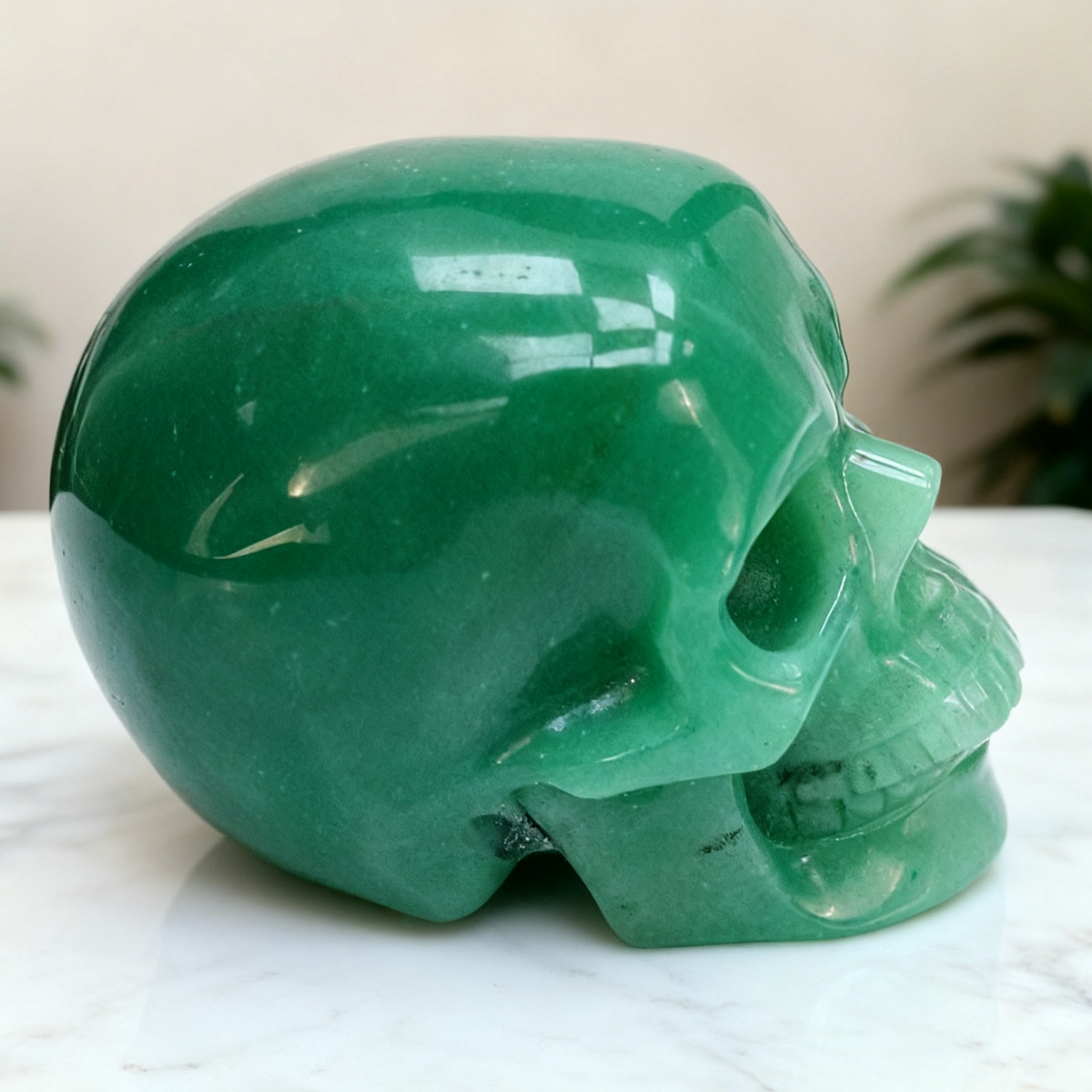 Additional view of a Green Aventurine human skull carving