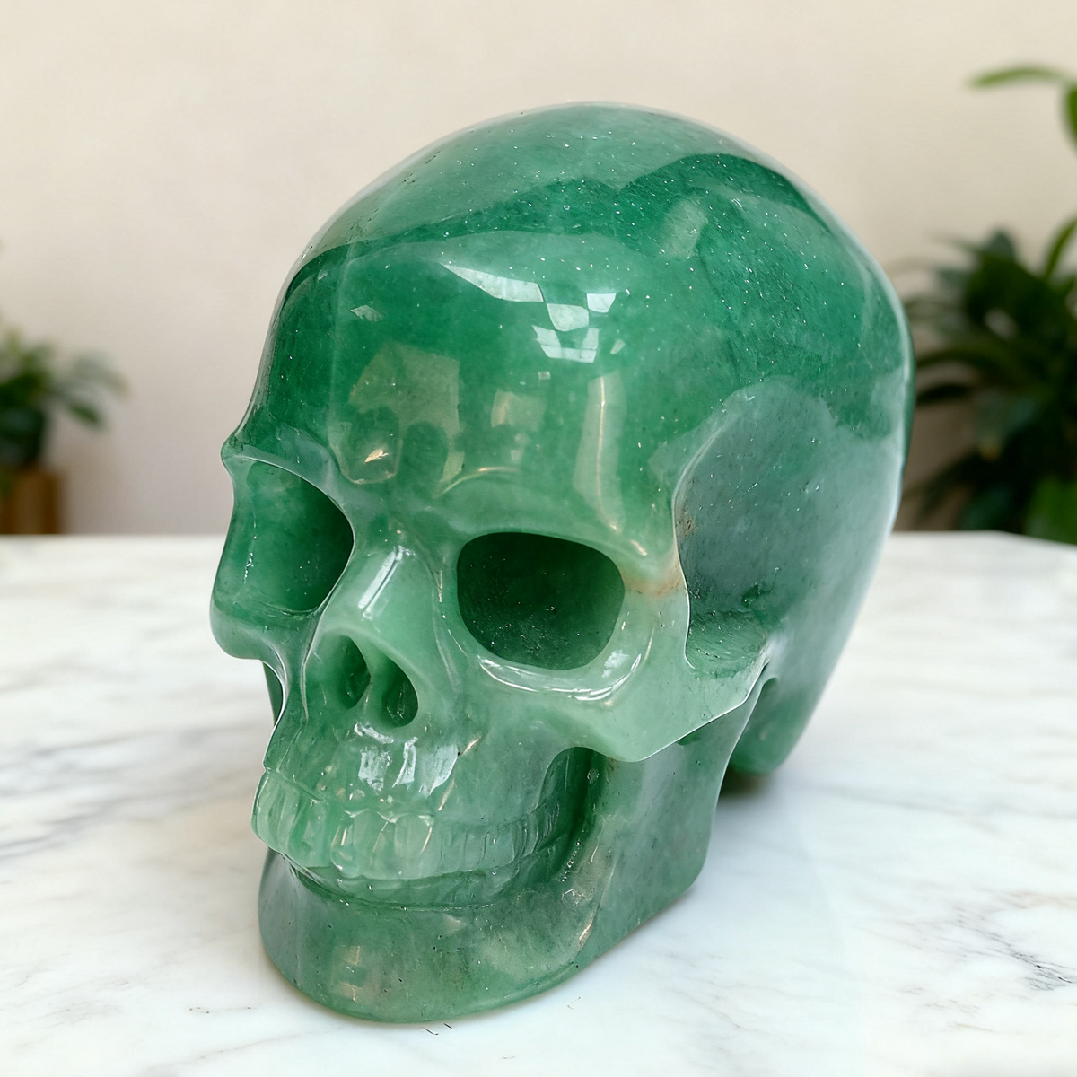 Additional view of a Green Aventurine human skull carving