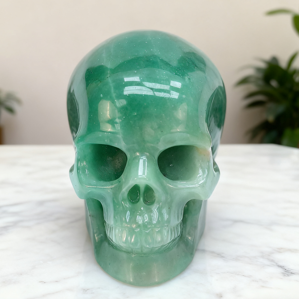 Additional view of a Green Aventurine human skull carving