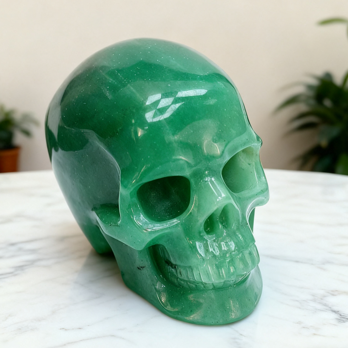 Additional view of a Green Aventurine human skull carving