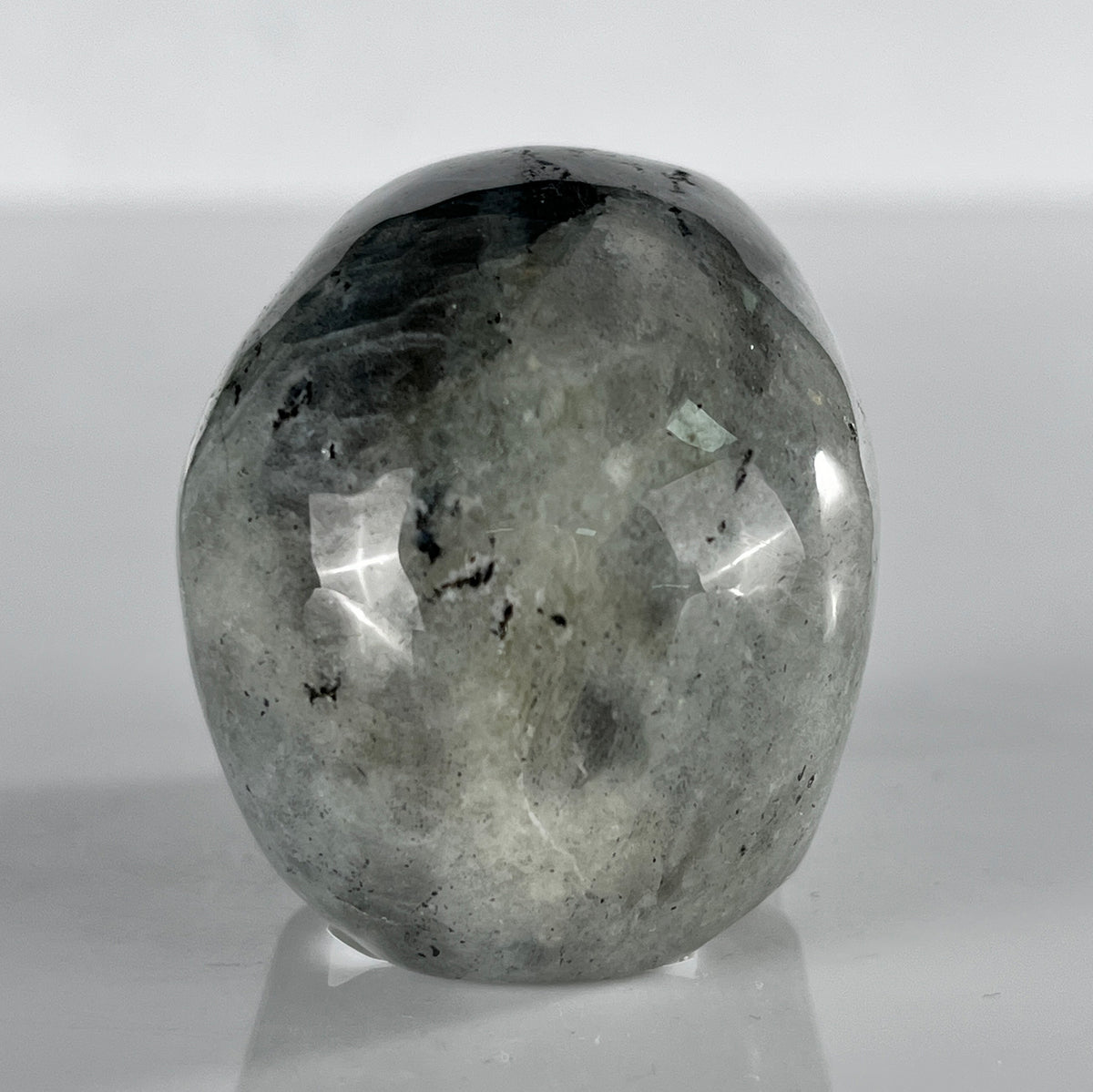 Back view of a 2-inch Grey Labradorite human skull carving