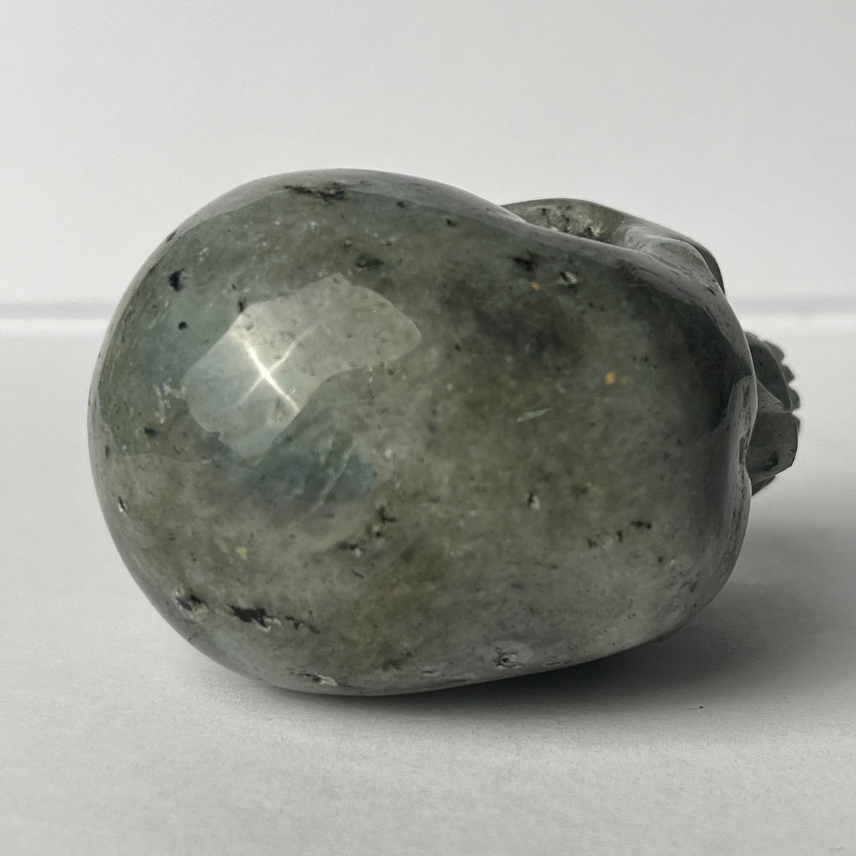 Top view of a 2-inch Grey Labradorite human skull carving
