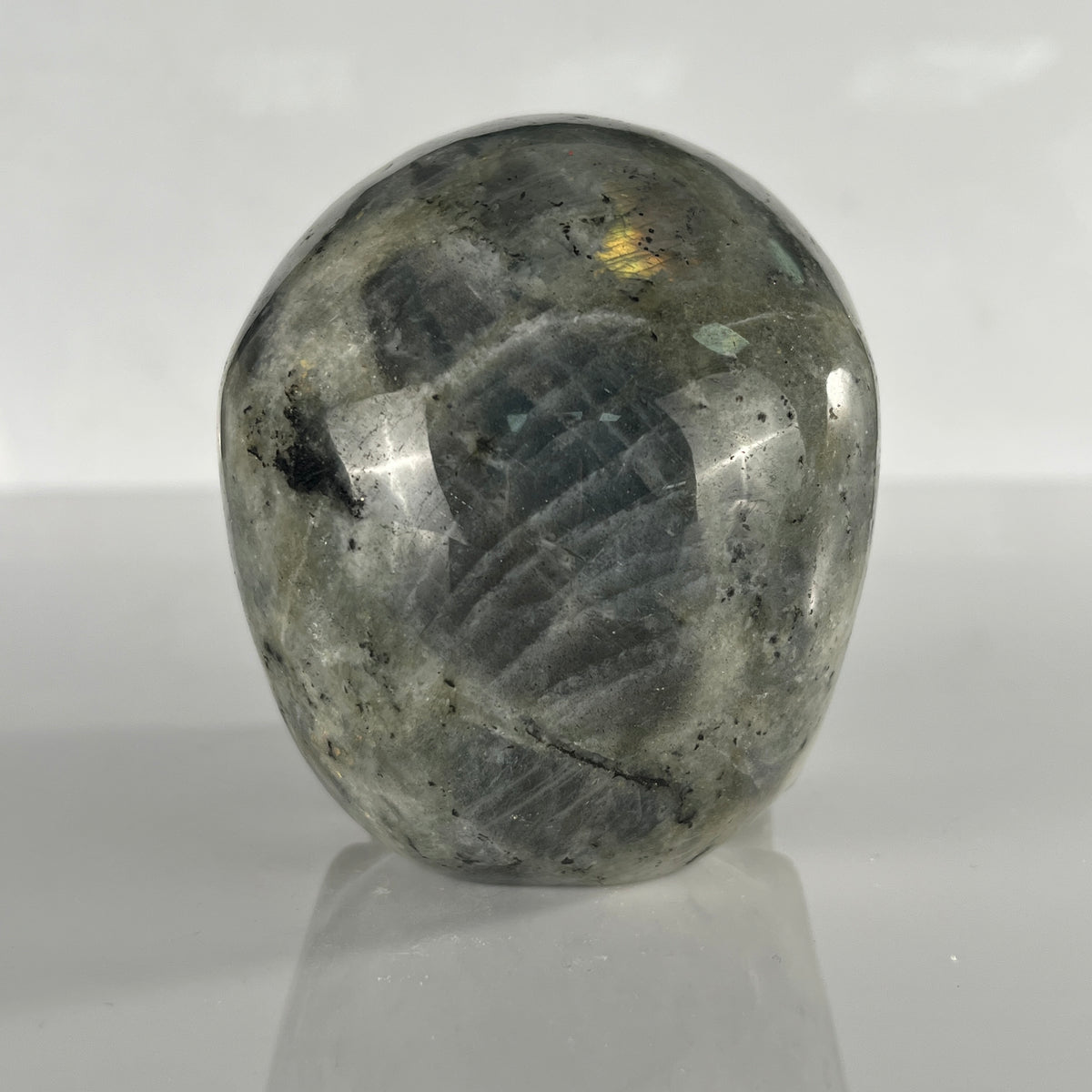 Back view of a 4.5-inch Grey Labradorite human skull carving