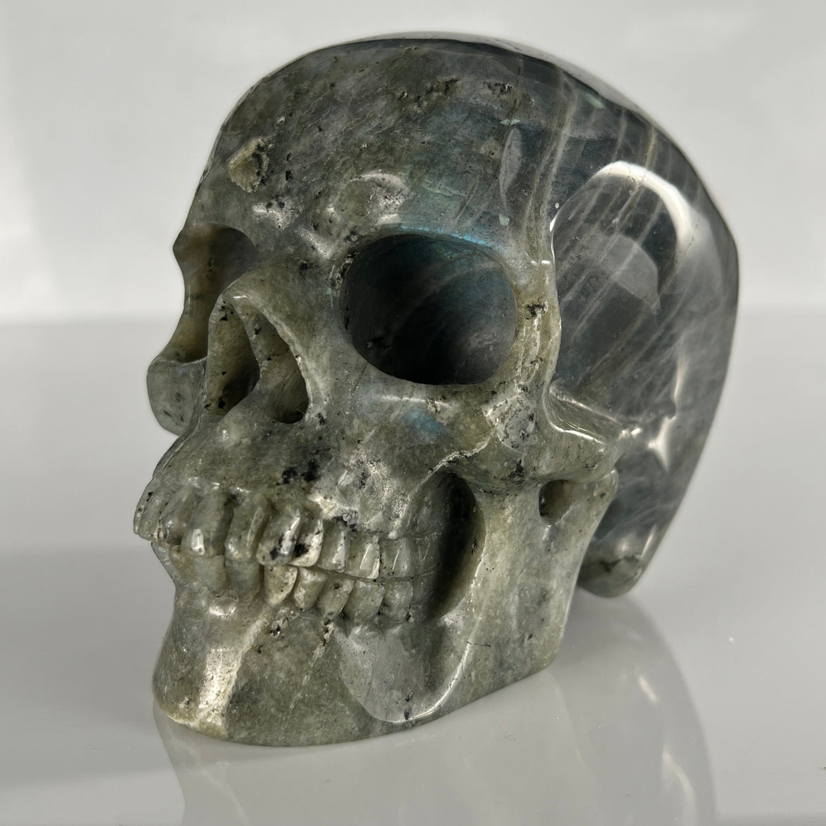 Left-front view of a 4.5-inch Grey Labradorite human skull carving