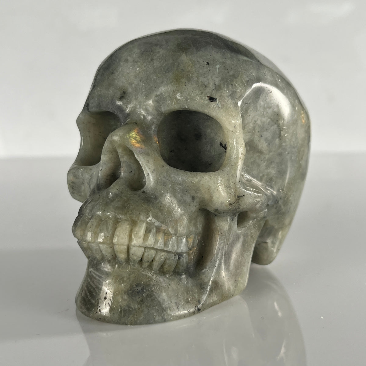 Left-front view of a 4.5-inch Grey Labradorite human skull carving