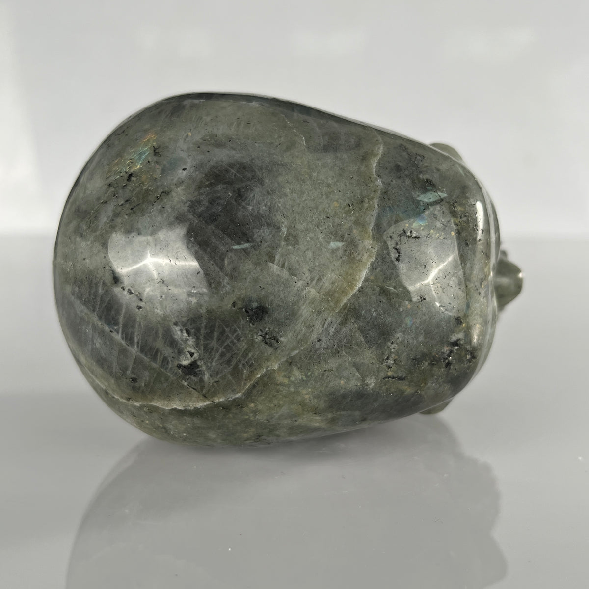 Top view of a 4.5-inch Grey Labradorite human skull carving