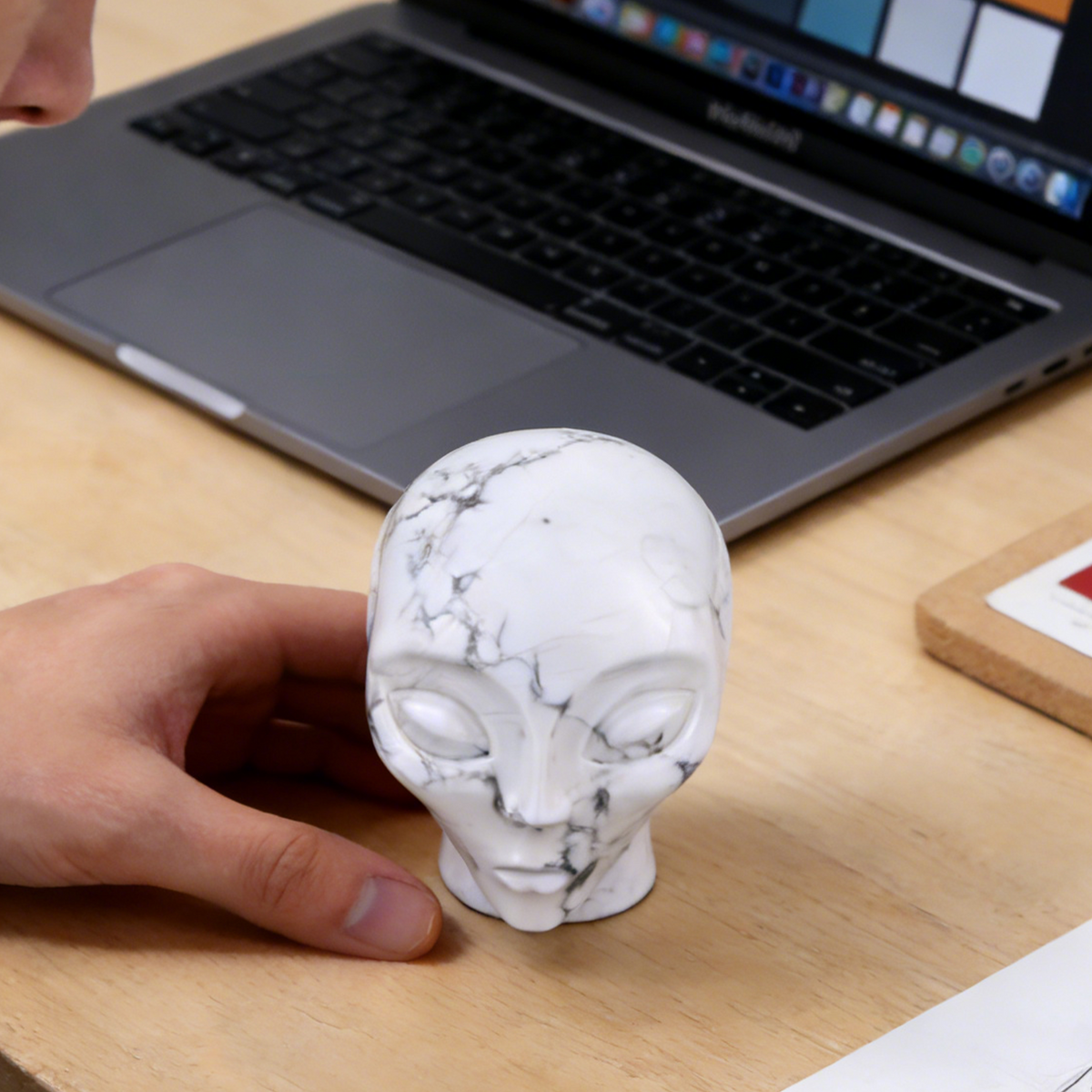 Additional view of a 3.8-inch Howlite alien skull carving