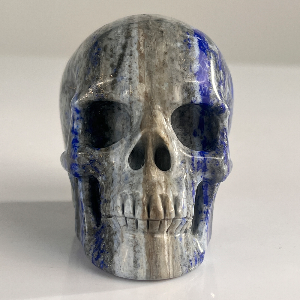 Front view of a 3-inch Lapis Lazuli human skull carving
