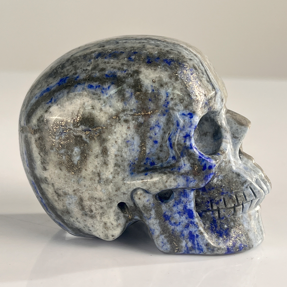 Right view of a 3-inch Lapis Lazuli human skull carving