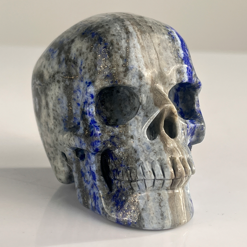 Right-front view of a 3-inch Lapis Lazuli human skull carving