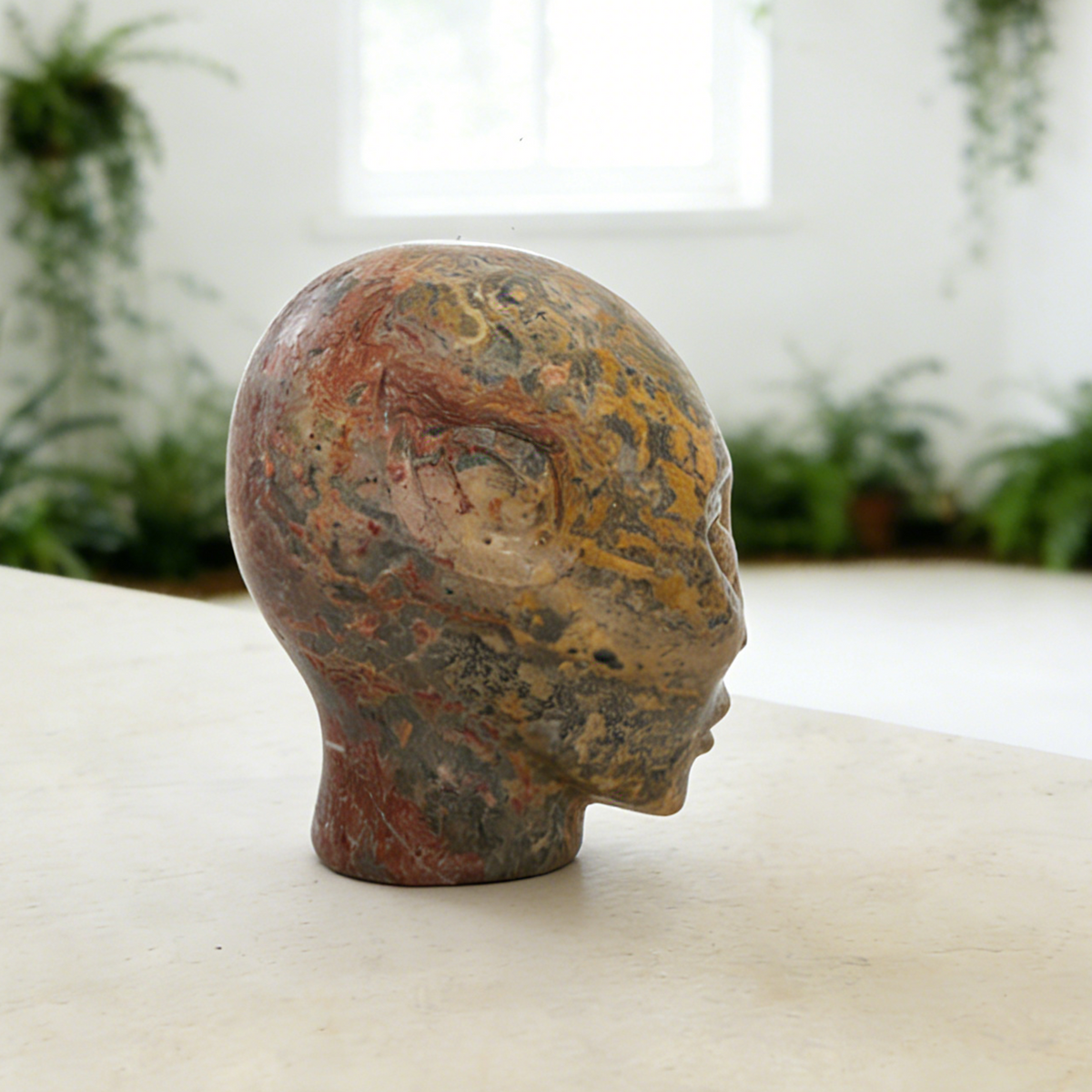 Additional view of a 3-inch Leopard Skin Jasper alien skull carving