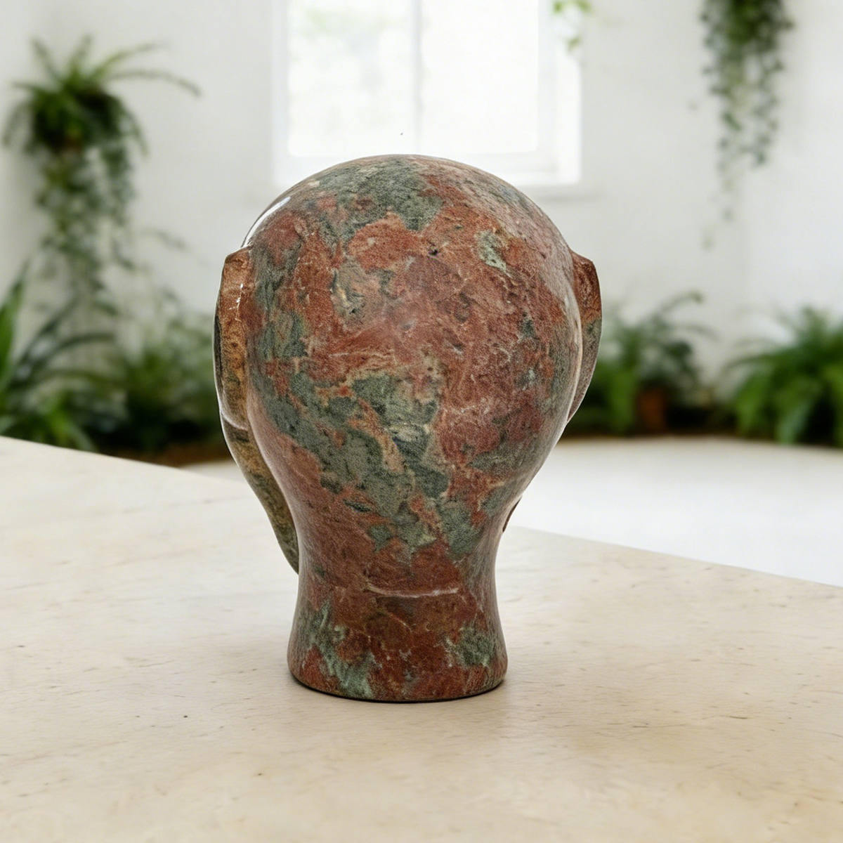 Additional view of a 3-inch Leopard Skin Jasper alien skull carving