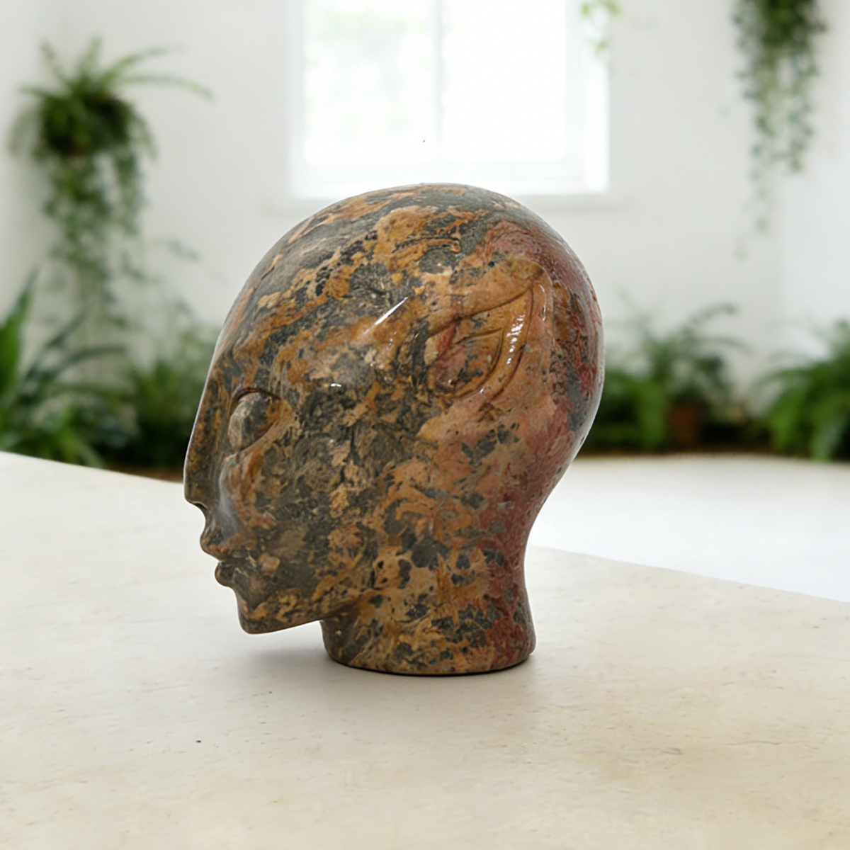 Additional view of a 3-inch Leopard Skin Jasper alien skull carving