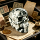 Main view of a 3-inch Moss Agate human skull carving