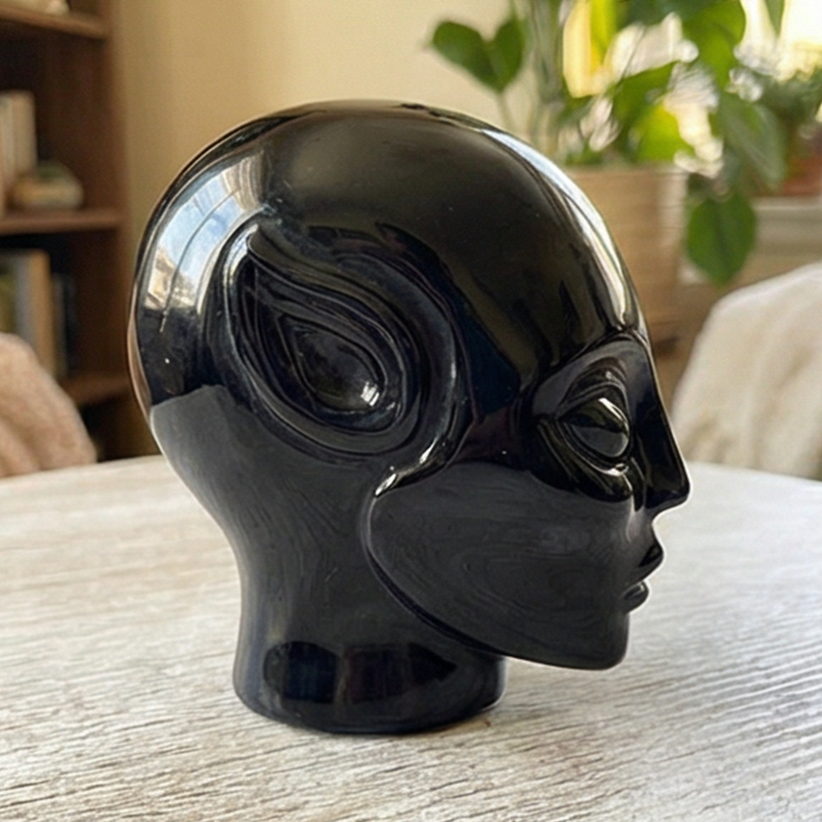 Additional view of a 2-inch Obsidian alien skull carving