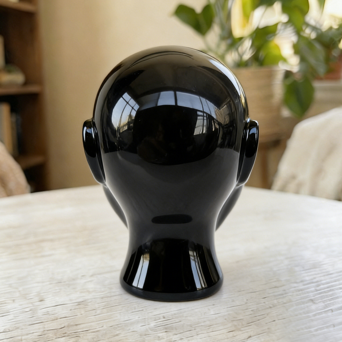 Additional view of a 2-inch Obsidian alien skull carving