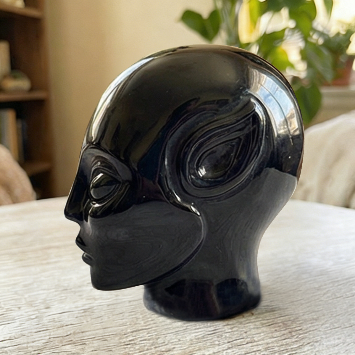 Additional view of a 2-inch Obsidian alien skull carving