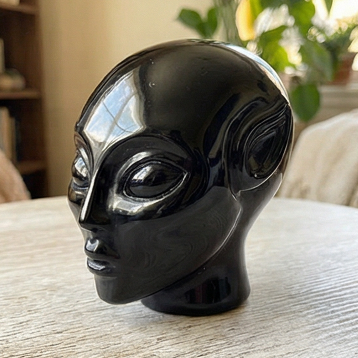 Additional view of a 2-inch Obsidian alien skull carving