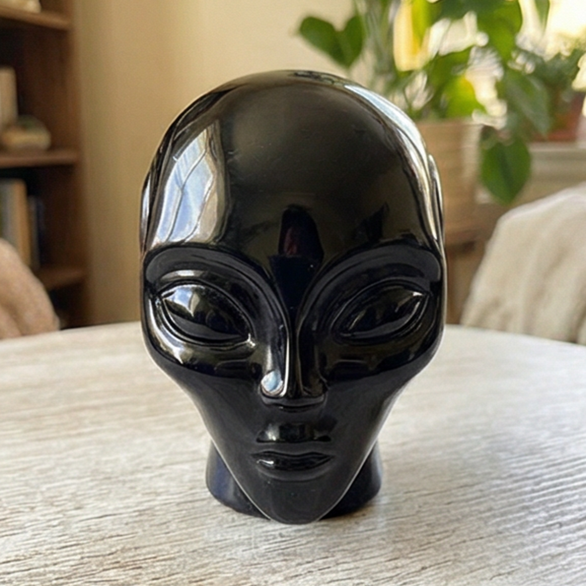 Additional view of a 2-inch Obsidian alien skull carving