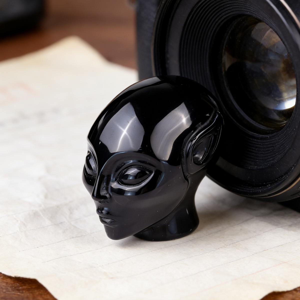 Additional view of a 2-inch Obsidian alien skull carving