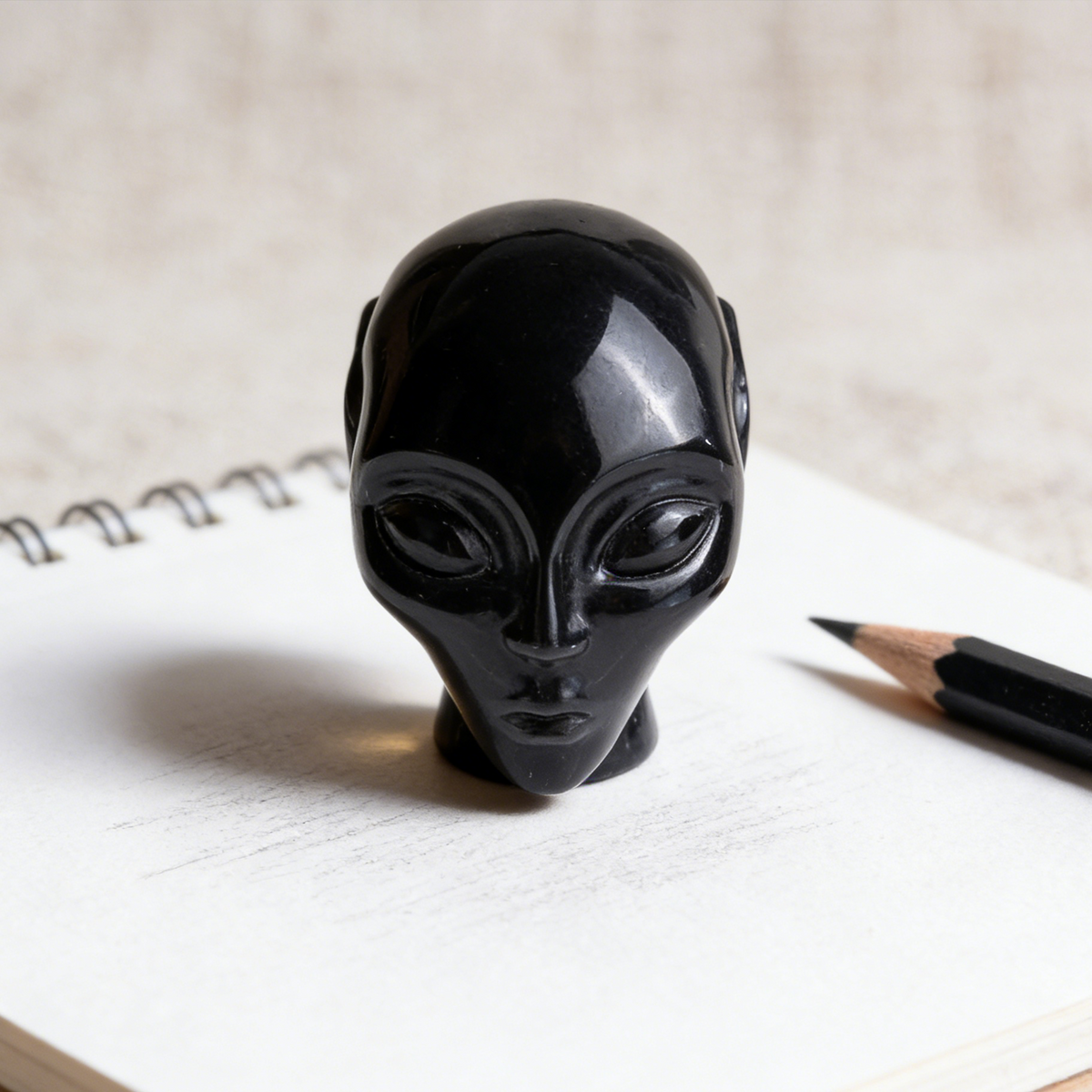 Additional view of a 2-inch Obsidian alien skull carving