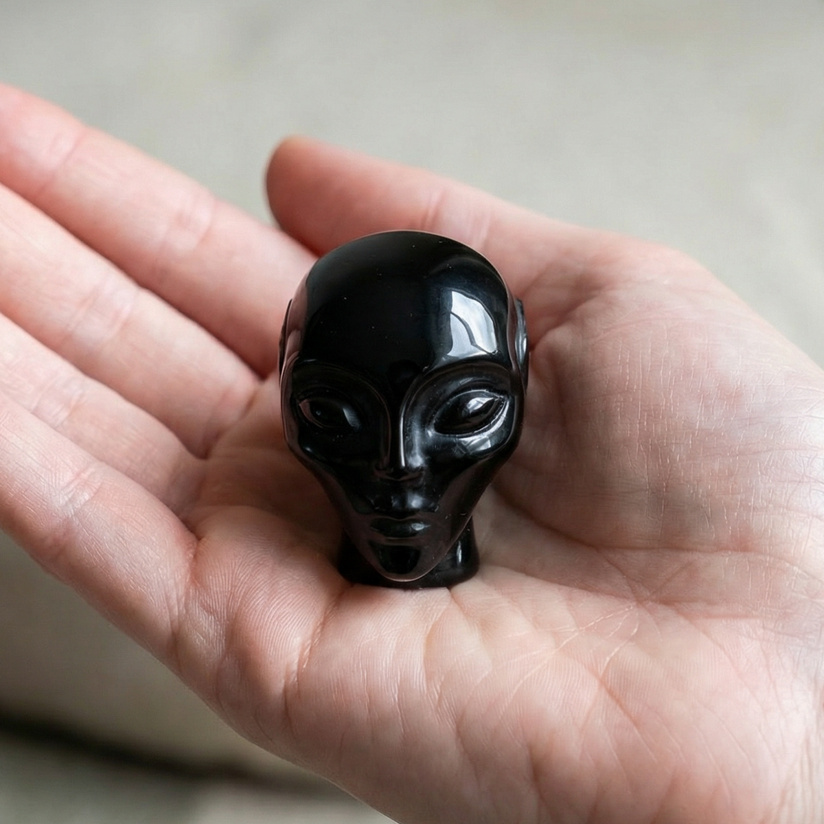 Additional view of a 2-inch Obsidian alien skull carving