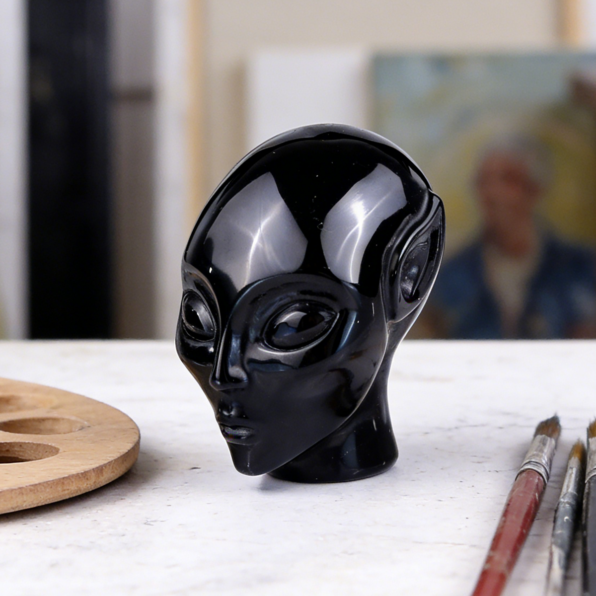 Additional view of a 3.8-inch Obsidian alien skull carving