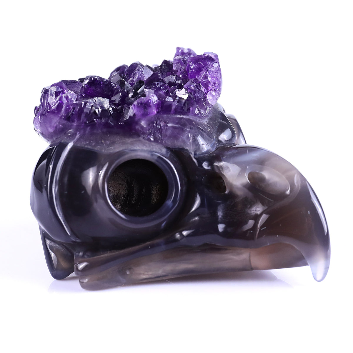 Right-front view of a one-of-a-kind Amethyst crystal-cluster owl skull carving