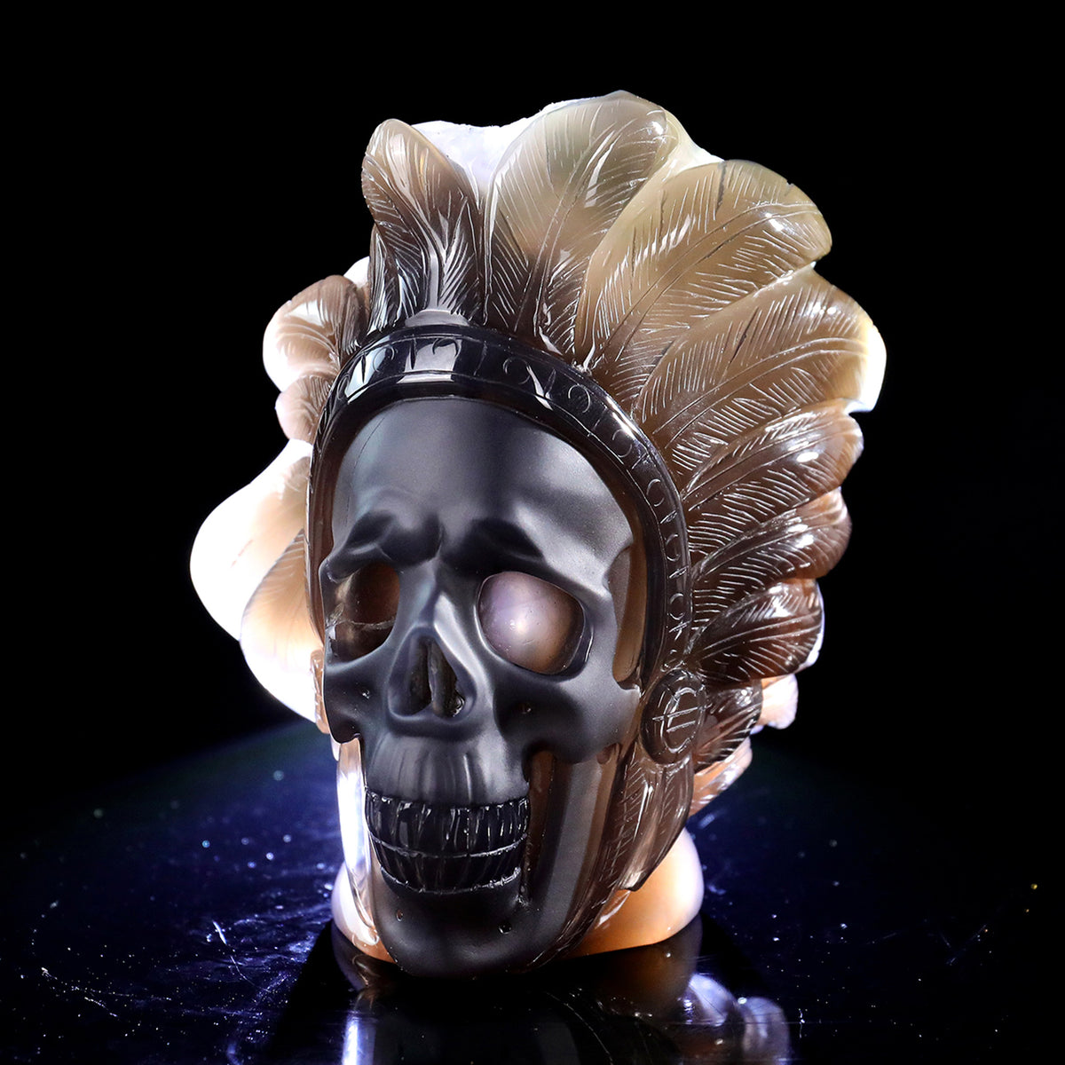 Left-front view of a one-of-a-kind Amethyst crystal-cluster skull with warbonnet carving